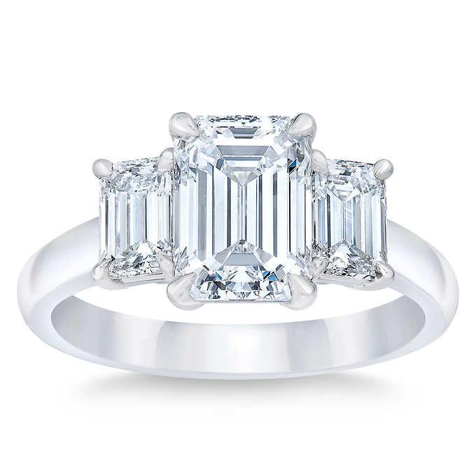 Natural 5 CT Diamond Engagement Ring 18K White Gold: Natural 5 CT Diamond Engagement Ring 18K White Gold Manufacturer's Suggested Retail Price: $92700.00 Centerstone : 1 Emerald Cut Diamond @ 2 CT Centerstone Clarity: VS1 Centerstone Color: G Stone 2: 2
