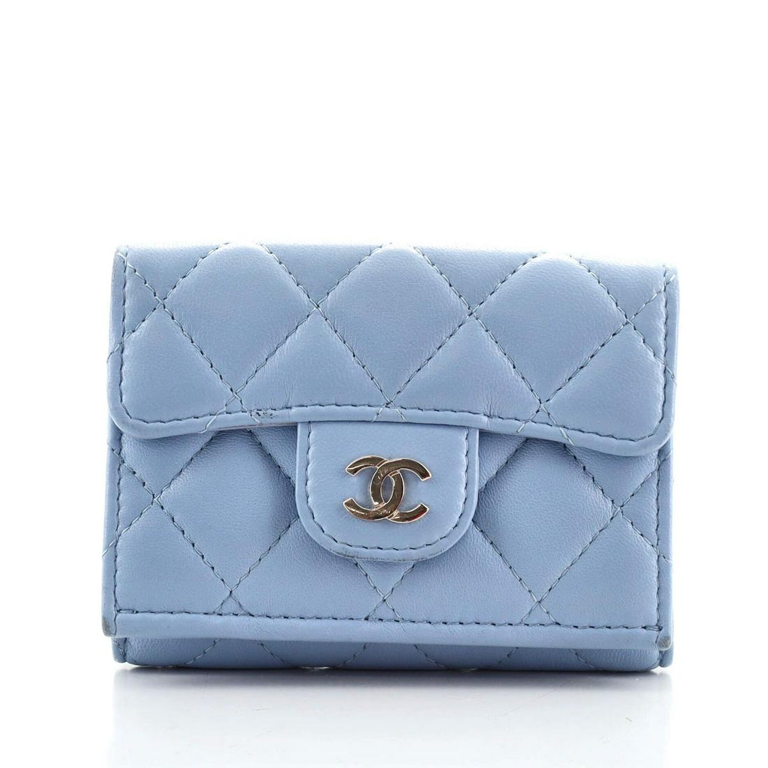 Double Sided Flap Wallet Quilted Lambskin Compact: Double Sided Flap Wallet Quilted Lambskin Compact Condition: Pre-owned Exterior Color: Blue Interior Color: Blue Exterior Material: Leather Interior Material: Fabric, Leather Hardware Color: Gold