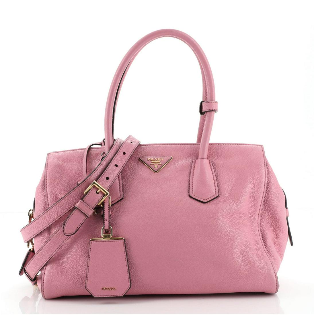 Prada Convertible Satchel Vitello Grain Medium: Prada Convertible Satchel Vitello Grain Medium Exterior Color: Pink Interior Color: Black Exterior Material: Leather Interior Material: Fabric Hardware Color: Gold Accessories: Clochette, Keys, Lock, 