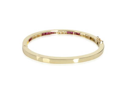 Vintage Channel Set Ruby & Diamond Bangle In 18K Yellow Gold 1.2 CTW: Vintage Channel Set Ruby & Diamond Bangle In 18K Yellow Gold 1.2 CTW SKU: RBJ255375738657-E Brand: CHANEL Condition: Pre-Owned Model: 255375738657-E More Details: Item