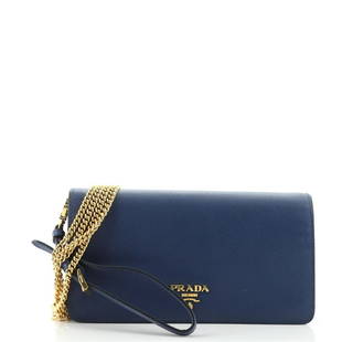 Prada Wristlet Wallet on Chain Saffiano Leather Mini: Prada Wristlet Wallet on Chain Saffiano Leather Mini Exterior Color: Blue Interior Color: Blue Exterior Material: Leather Interior Material: Leather Hardware Color: Gold 