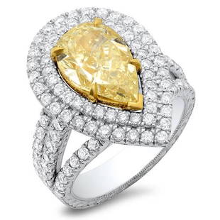 Natural 3.42 CTW Canary Yellow Pear Shape Halo Diamond Ring 18KT Two-tone: Natural 3.42 CTW Canary Yellow Pear Shape Halo Diamond Ring 18KT Two-tone Manufacturer's Suggested Retail Price: $ 52800.00 Center Stone Type: Diamond Center Stone QTY: 1 Center Stone CTW: 2.02