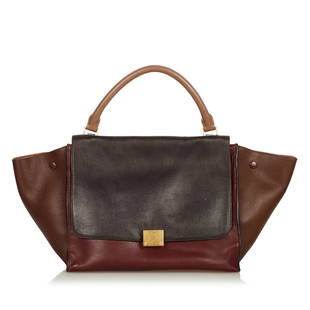 Celine Trapeze Bicolor Leather Satchel: Celine Trapeze Bicolor Leather Satchel Condition Quality: Fair Color: Black/Brown Height: 9.25 in. Length: 11.75 in. Material: Calf Width: 5.75 in. Item Condition: Pre Owned 