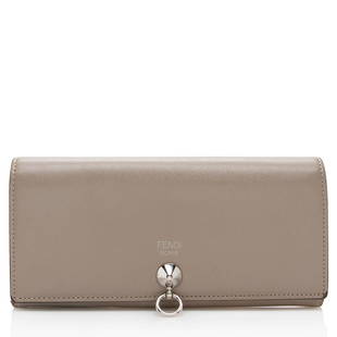 Fendi Calfskin By The Way Continental Wallet: Fendi Calfskin By The Way Continental Wallet Condition Quality: Fair Color: Beige Height: 4 in. Length: 7.5 in. Material: Leather Width: 0.5 in. Item Condition: Pre Owned SKU: