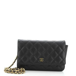 Chanel Wallet on Chain Quilted Caviar: Chanel Wallet on Chain Quilted Caviar Exterior Color: Black Interior Color: Red Exterior Material: Leather Interior Material: Fabric, Leather Hardware Color: Gold Accessories: Dust