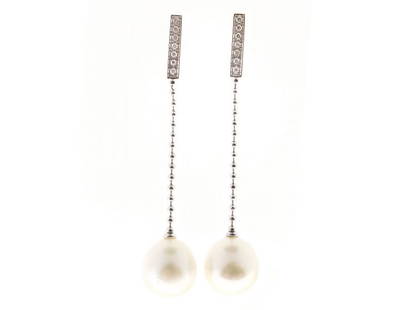 Gellner 18K White Gold South Sea Pearl & 0.14ct Diamond Dangle Earrings: Gellner 18K White Gold South Sea Pearl & 0.14ct Diamond Dangle Earrings SKU: RBJ341-539-433-01C9A Condition: Pre-Owned Metal: White Gold Stone Size and Fit: Length: 2 3/8", South Sea