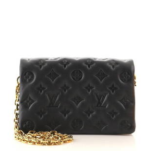 Louis Vuitton Coussin Pochette Monogram Embossed Lambskin: Louis Vuitton Coussin Pochette Monogram Embossed Lambskin Exterior Color: Black Interior Color: Pink Exterior Material: Leather Interior Material: Microfiber Hardware Color: Gold 