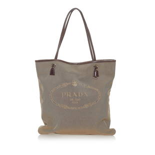 Prada Canapa Logo Canvas Tote Bag: Prada Canapa Logo Canvas Tote Bag Condition Quality: Fair Color: Brown Height: 13.75 in. Length: 11.5 in. Material: Canvas Width: 0.5 in. Item Condition: Pre Owned SKU: