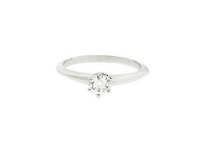 Tiffany Platinum .23 Carat VS1-E Solitaire Engagement Ring: Tiffany Platinum .23 Carat VS1-E Solitaire Engagement Ring SKU: RBJ333370385241-E Brand: Tiffany Condition: Pre-Owned Metal: Platinum Stone: Diamond Model: 333370385241-E Item Specifics:Brand: