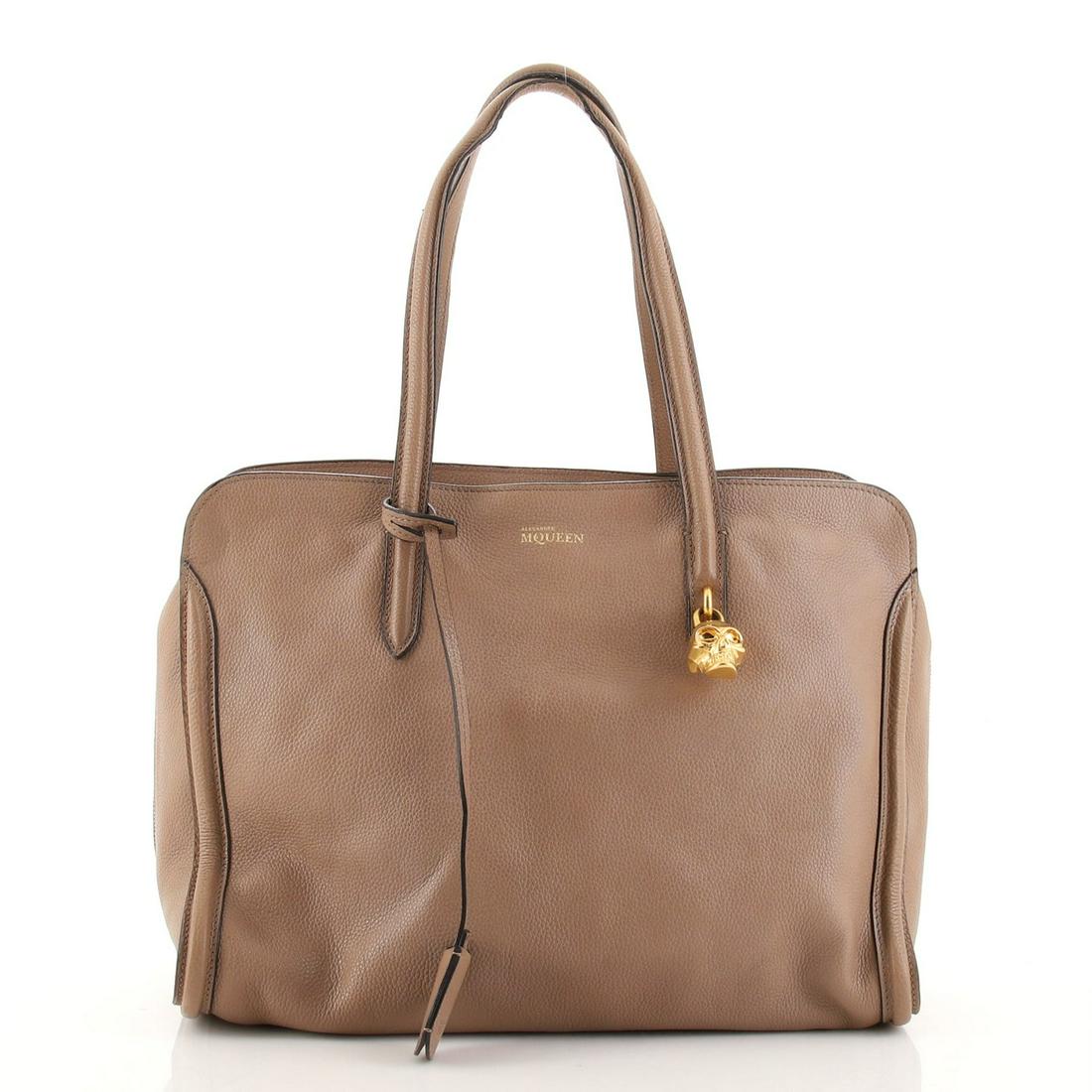 Alexander McQueen Padlock Zip Around Tote Leather Medium: Alexander McQueen Padlock Zip Around Tote Leather Medium Exterior Color: Neutral Interior Color: Black Exterior Material: Leather Interior Material: Fabric Hardware Color: Gold Accessories: Cloche