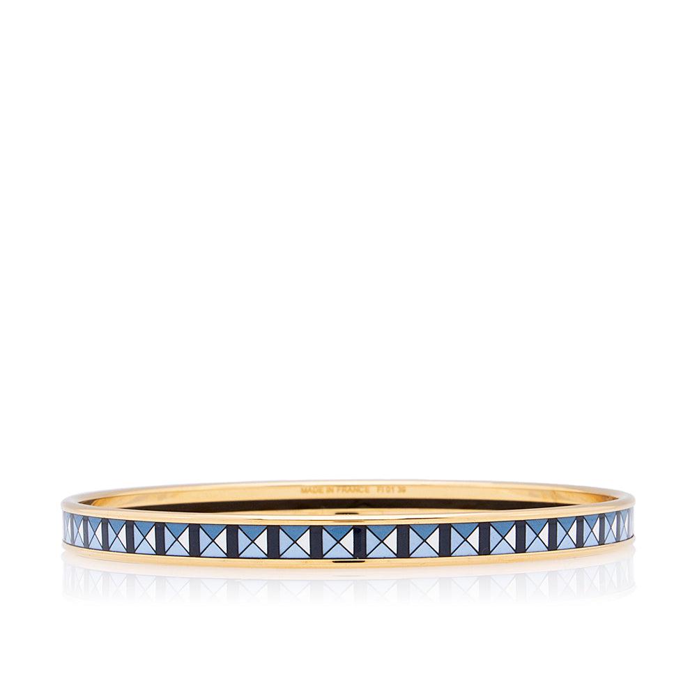Hermes Printed Enamel Narrow Bracelet: Hermes Printed Enamel Narrow Bracelet Condition Quality: Excellent Color: Blue/Gold/White Material: Enamel/Gold Tone Metal Width: 0.13 in. Item Condition: Pre Owned SKU: RBJ-20638