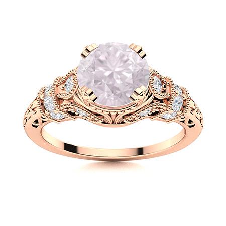 Natural 1.75 CTW Rose Quartz & Diamond Engagement Ring 14K Rose Gold: Natural 1.75 CTW Rose Quartz & Diamond Engagement Ring 14K Rose Gold Manufacturer's Suggested Retail Price: $3150.00 Center Stone: 1 Rose Quartz @ 1.41 ctw Center Stone Color: Pink Center Stone Clarit