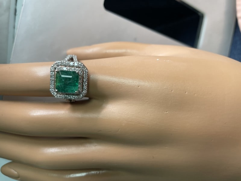 Emerald-Cut Emerald And Double Halo Diamond Split Shank Ring In 14K White Gold: Emerald-Cut Emerald And Double Halo Diamond Split Shank Ring In 14K White Gold Product Code: EMERALD-CU-628E63DC26C43 Condition: Never Worn Final Sale: THIS ITEM IS FINAL SALE AND NOT RETURNABLE. Moun