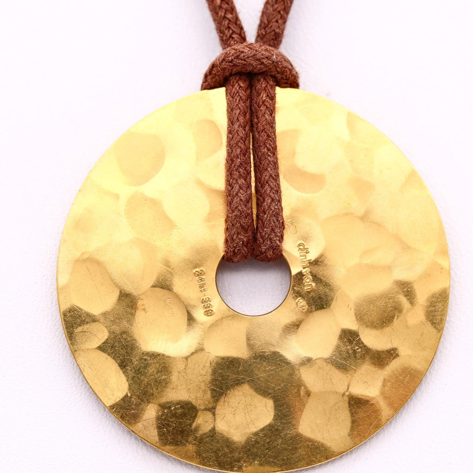Dinh Van Paris Large Pi Necklace Pendant In Hammered 24Kt Yellow Gold: Dinh Van Paris Large Pi Necklace Pendant In Hammered 24Kt Yellow Gold Metal: Gold, 24k Gold, Yellow Gold Weight: 20.75 g Dimensions: Diameter: 1.57 in (39.88 mm) Length: 20 in (508 mm) Sold As: Set of