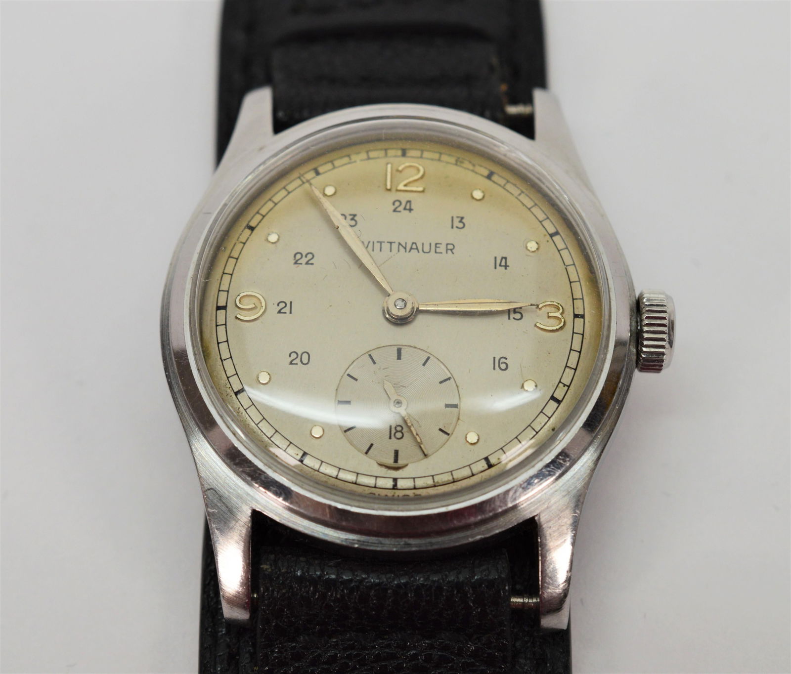 Wittnauer WWII Style Wrist Watch: Wittnauer WWII Style Wrist Watch Brand: Wittnauer Case Material: Stainless Steel Weight: 32.96 g Strap Material: Leather Case Shape: Round Movement: Manual Wind Case Dimensions: Diameter: