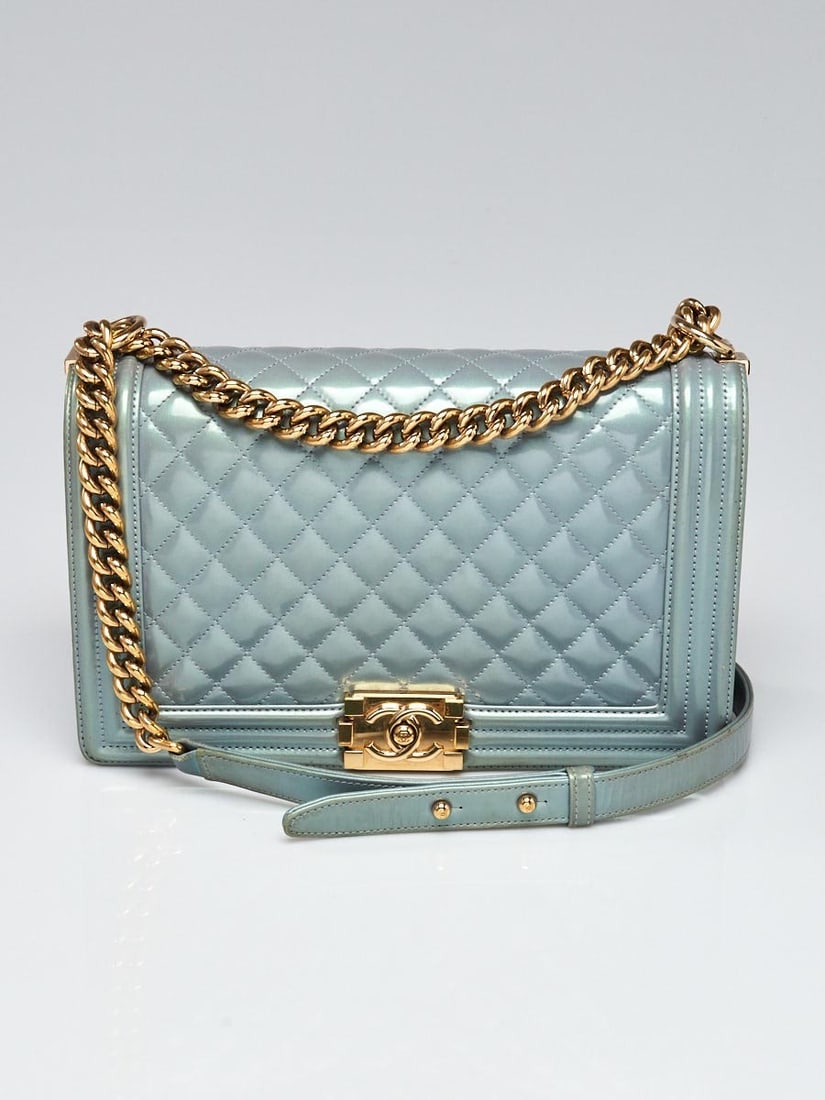 Chanel Blue Iridescent Quilted Patent: Chanel Blue Iridescent Quilted Patent Leather New Medium Boy Bag Overall Condition: Gently used Exterior Condition: Gently used Interior Condition: Gently used Designer: Chanel Material: Blue iridesce