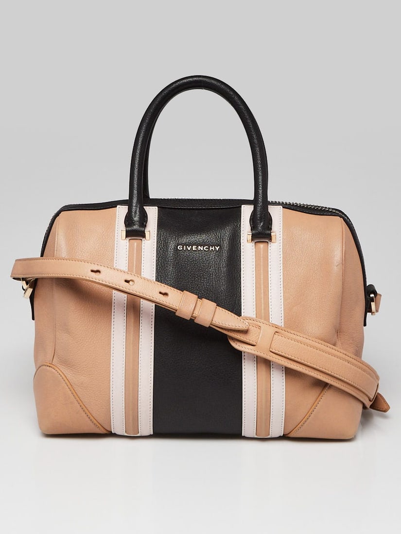Givenchy Beige/Black Calfskin Leather Medium: Givenchy Beige/Black Calfskin Leather Medium Lucrezia Duffle Bag Overall Condition: Gently used Exterior Condition: Like new Interior Condition: Like new Designer: Givenchy Material: Beige and black l