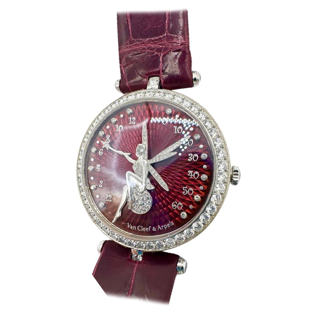 Van Cleef and Arpels Lady Arpels: Van Cleef and Arpels Lady Arpels Feerie Rouge Watch Brand: Van Cleef & Arpels Stone: Diamond Stone Cut: Round Cut Movement: Manual Wind Case Dimensions: Height: 8 in (203.2 mm) Width: 1.5 in (38.1 mm)