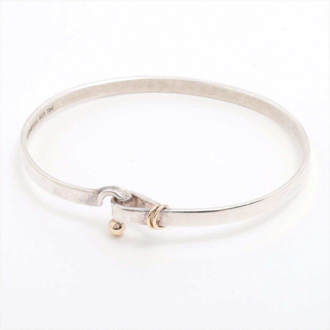Tiffany Hook & Eye Bangle 925x750: Tiffany Hook & Eye Bangle 925x750 12.1g Silver x gold Condition: Pre-owned Detail Notes: ?Good : Used with a few stains and/or scratches. A3110282? Style: Bracelet Material: 925x750 Color: Silver x go