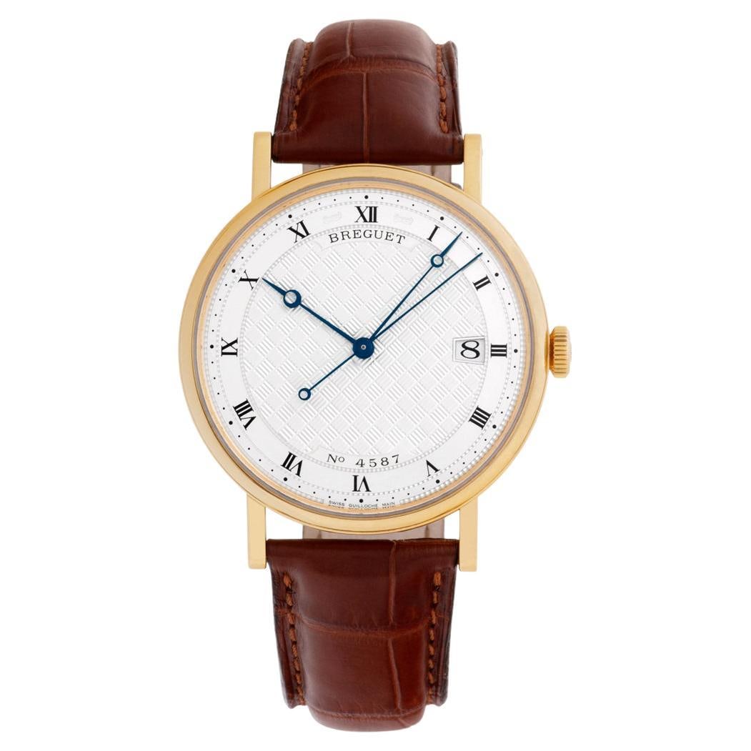 Breguet Classique in 18k Gold with: Breguet Classique in 18k Gold with Silver Guilloche Dial Watch Brand: Breguet Case Material: 18k Gold, Silver, Yellow Gold Case Shape: Round Case Dimensions: Width: 1.5 in (38 mm) Length: 1.5 in (38 m