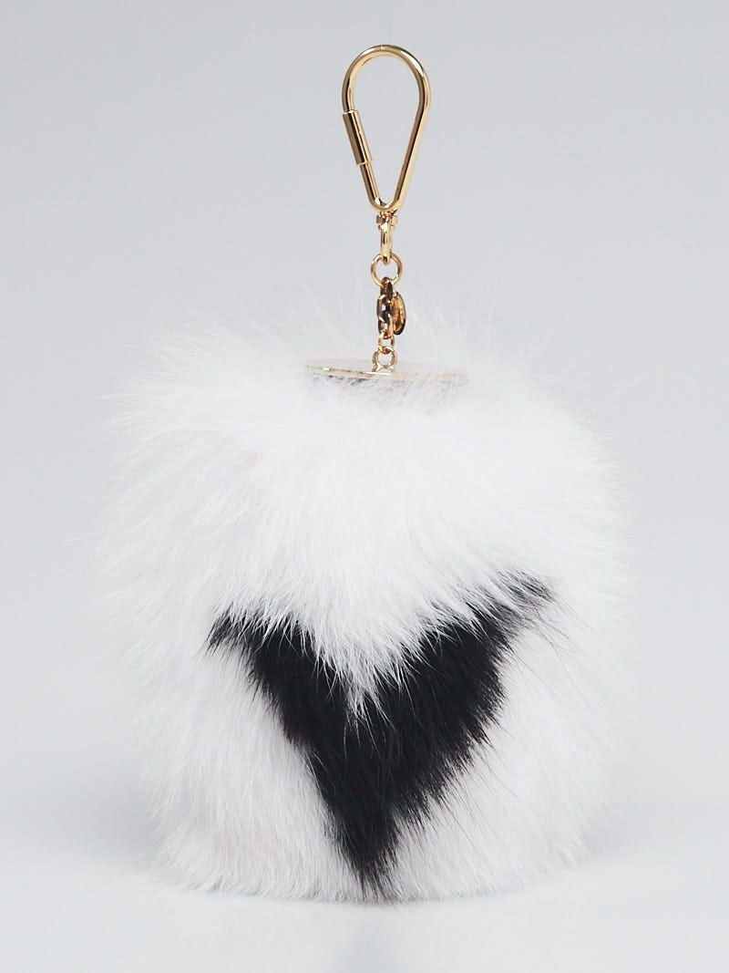 Louis Vuitton White Fox Fur Fuzzy: Louis Vuitton White Fox Fur Fuzzy V Bag Charm Overall Condition: Like new Designer: Louis Vuitton Material: White fox fur, metal, patent leather Includes: LV dust bag Origin: Italy Production Year
