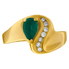Pear shaped emerald ring with diamond