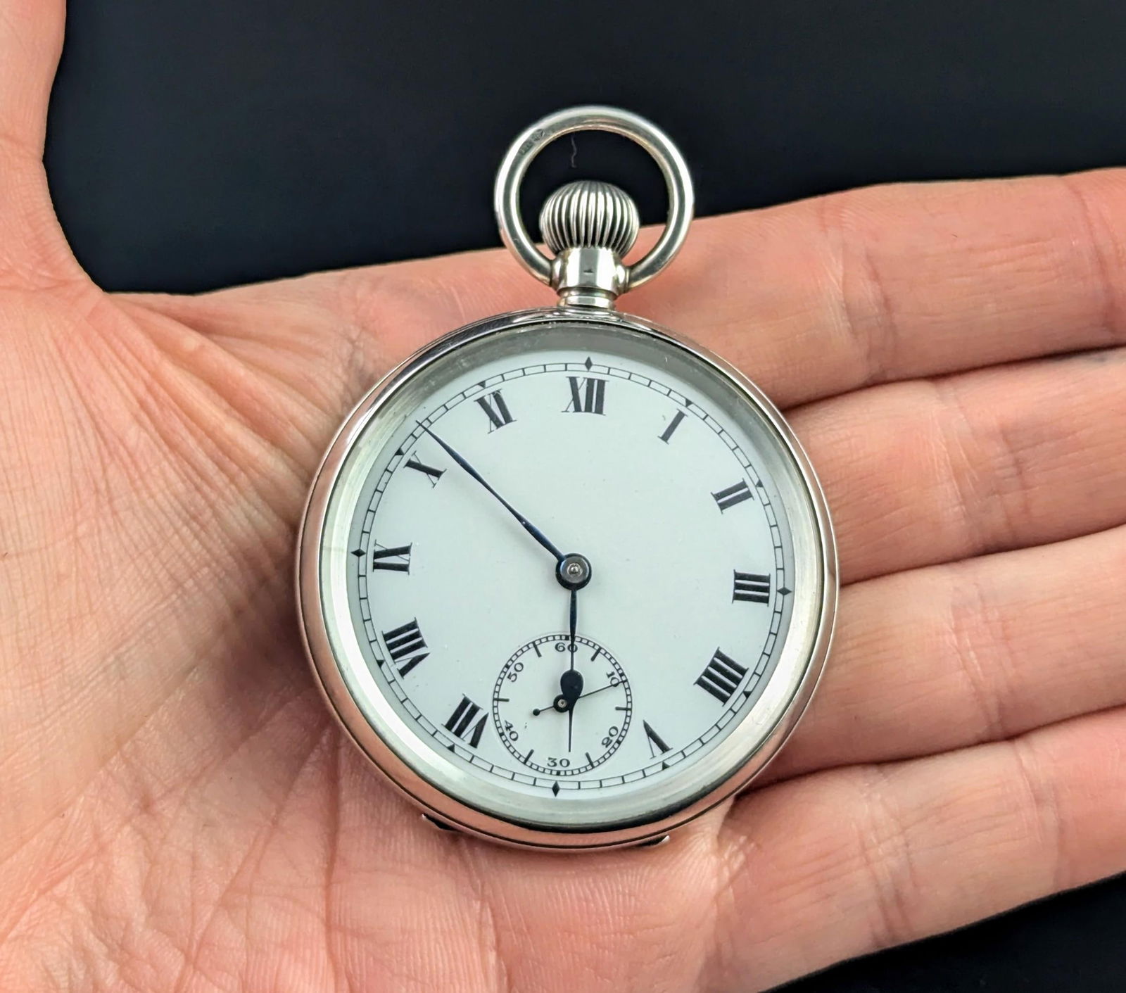 Antique Sterling silver pocket watch, Art: Antique Sterling silver pocket watch, Art Deco Case Material: Sterling Silver Weight: 85.07 g Case Shape: Round Movement: Manual Wind Case Dimensions: Height: 0.12 in (2.8 mm) Width: 0.08 in (2 mm) <b