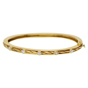 Bangle bracelet with 5 swirls in