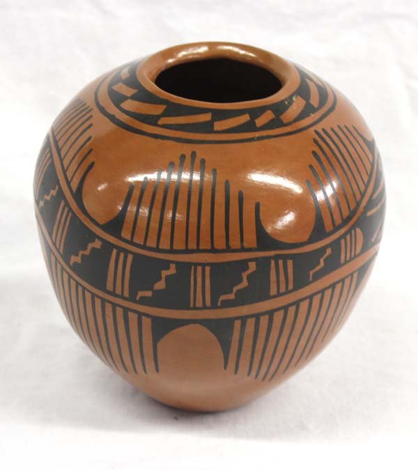 Mata Ortiz Jar by Chela Sota: Mata Ortiz Jar by Chela Sota. With its geometric design this piece measures 6 in x 6 in. Mata Ortiz is a small village in the state of Chihuahua, Mexico. The potters of Mata Ortiz create contemporary 