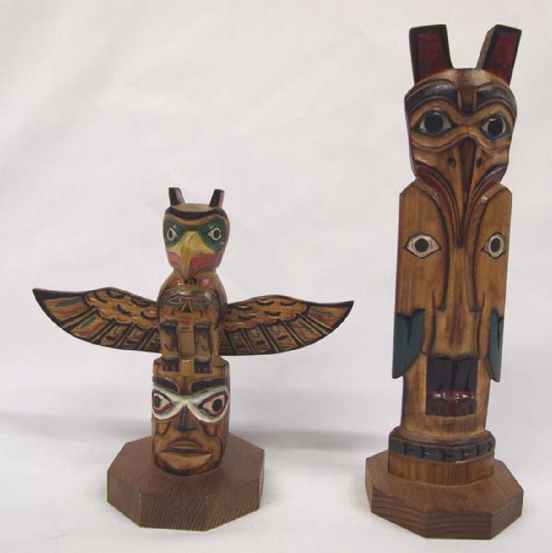 2 Northwest Coast Totems: 2 Northwest Coast Totems. Both are signed by the artists and the largest is 8 1/2in x 3in.
