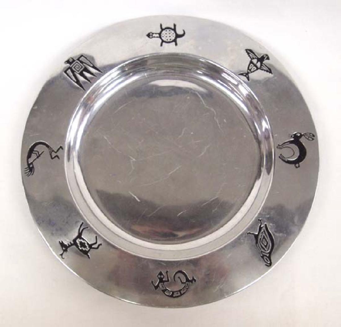 Wilton Armetale Serveware Plate: Wilton Armetale Serveware Plate, Mimbres Designs along rim (antelope, lizard, quail, rabbit, bird, turtle, swallow and kokopelli), measures 11.75''D, hallmarked, used at the La Fonda Hotel in the La P
