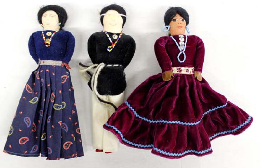 3 Native American Navajo Cloth Dolls: 3 Native American Navajo Cloth Dolls in traditional dress, embellished with beaded necklaces and earrings with sequin accents, hand painted facial features, longest measures 9.5'' x 10''