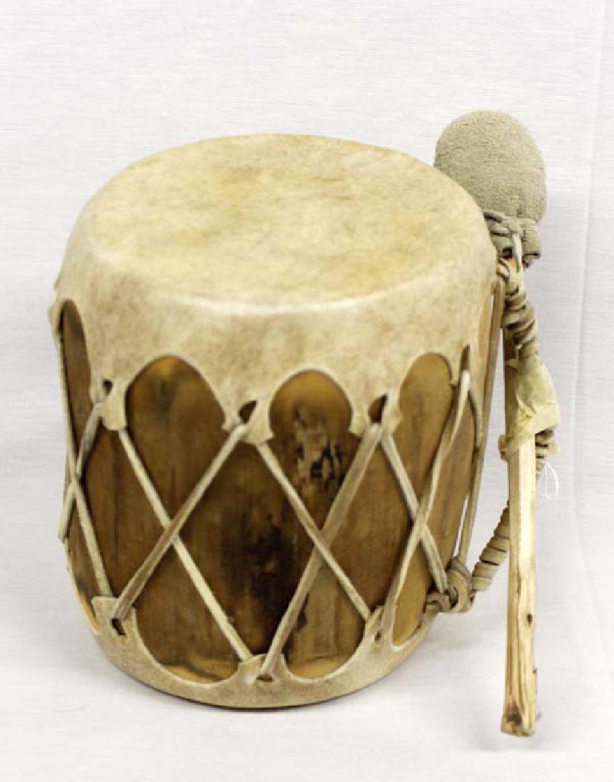 Native American Taos Drum with Beater: Native American Taos Drum with Beater, measures 6'' x 7.5'', hide covered heads and hollowed log body, leather ties