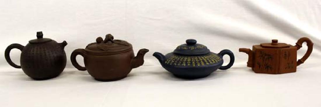 4 Chinese Yixing Zisha Clay Teapots: 4 Beautiful Chinese Yixing Zisha Clay Teapots, all are hallmarked on the bottom, fabulous collection, largest measures 7''L x 3.5''H, all have lids