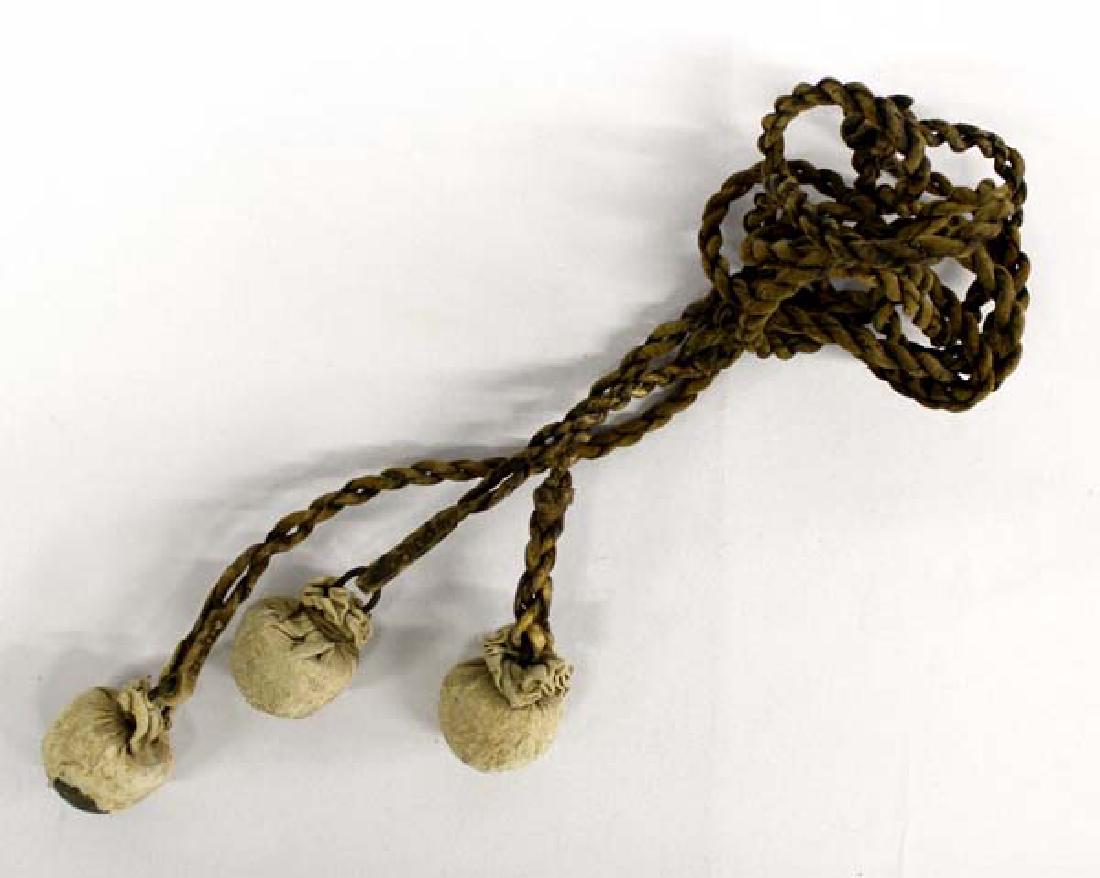 Vintage Argentinian Bolas or Boleadoras: Vintage Argentinian Bolas or Boleadoras, measure 38''L, canvas covered bolas
