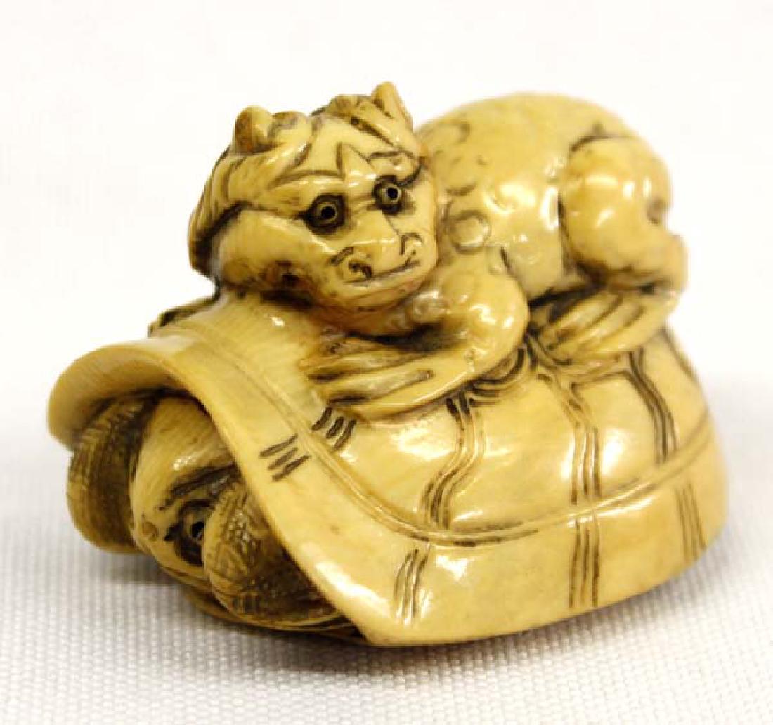 Antique Japanese Carved Bone Netsuke Turtle: Hummert Estate Antique Japanese Carved Bone Netsuke Turtle hiding in shell with a kappa creature crouching on top of turtle's shell, early 20th century, signed by artist, measures 1.5''L x 1 1/8''H x