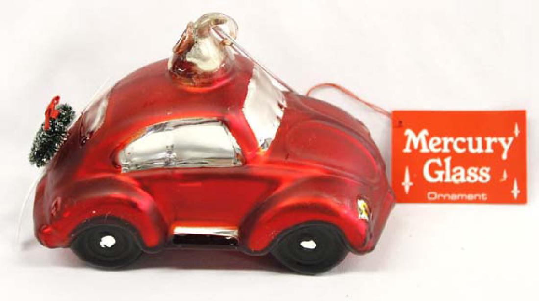 Large Mercury Glass Volkswagon Beetle Ornament: Large Department 56 Mercury Glass Volkswagon Beetle Ornament with Wreath and Skiis, measures 7''L x 3.5''W x 3''H, one of the skiis is missing the tip