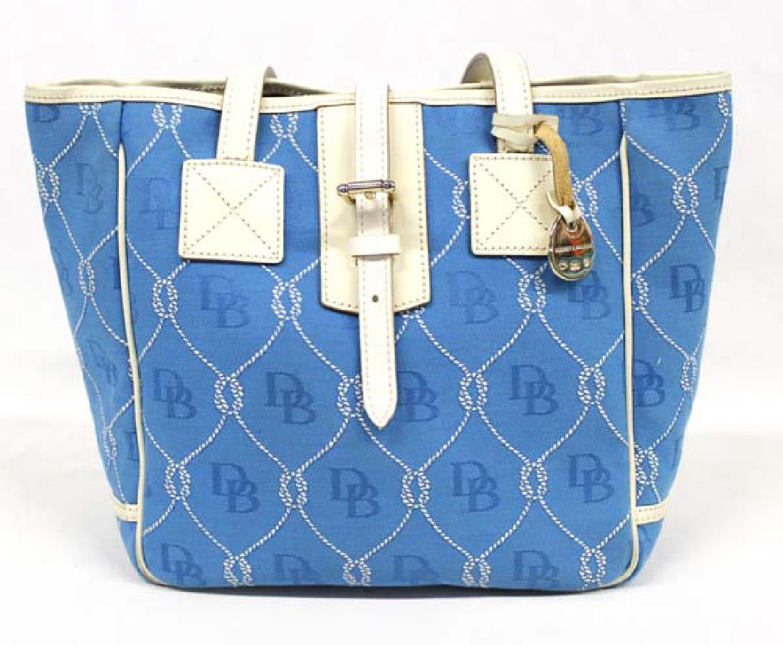 Dooney & Bourke Blue and White Purse: Blue and White Dooney & Bourke Purse, DB logo printed all over fabric, leather handles, measures 10'' x 12''