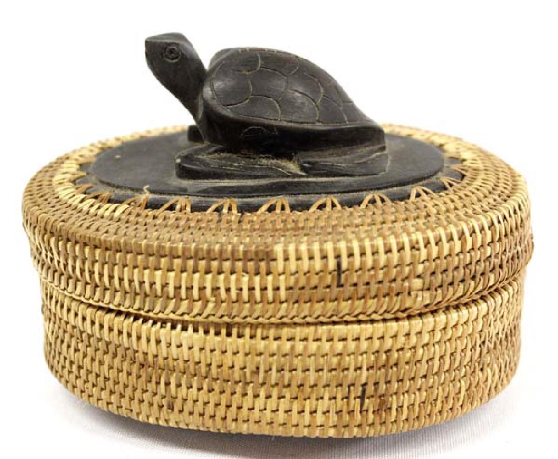 Indonesian Tightly Woven Basket with Turtle Lid: Hummert Estate Indonesian Tightly Woven Basket with Carved Wood Turtle Lid, measures 5''L x 2 3/8''H, beautiful carved wood turtle on lid, wood bottom with 2 legs