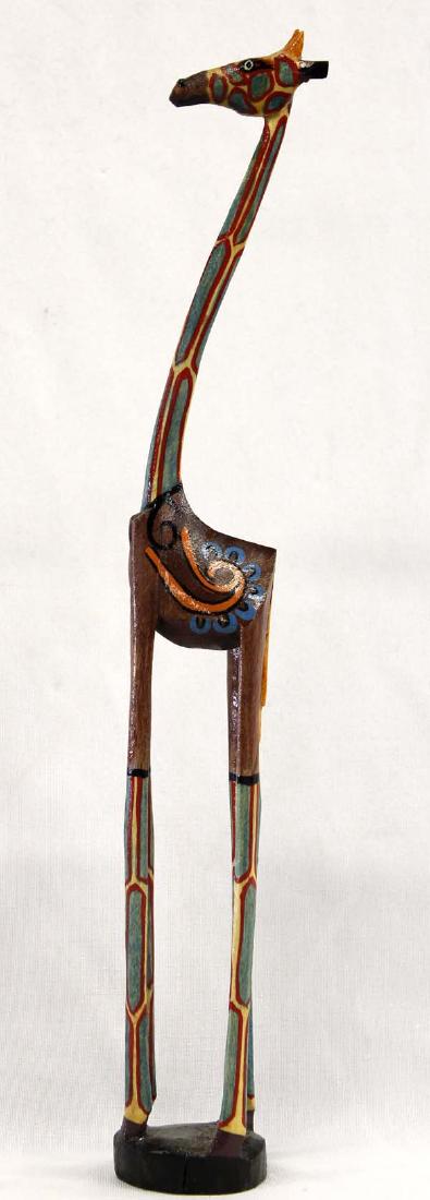 2002 African Carved Wood Giraffe by Robert: Hummert Estate: 2002 African Carved Wood Giraffe by Robert, measures 15.5''H x 2''W x 1.75''Deep, beautifully painted and signed by artist
