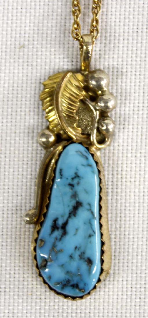 Navajo 12K Gold Filled & Silver Pendant Necklace: Native American Navajo 12K Gold Filled & Silver Turquoise Pendant Necklace by Lucy C., hallmarked and engraved, pendant measures 1.5''L, chain is marked 1/20 Gold Filled and measures 16''L end to end,