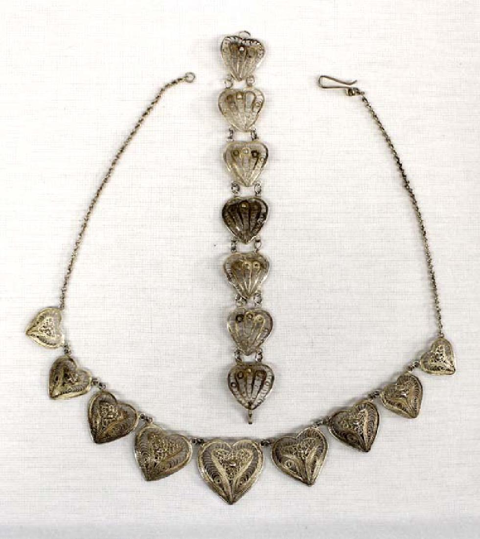 Antique Mexican Sterling Necklace and Bracelet: Antique Mexican Sterling Necklace and Bracelet, beautiful filigree heart necklace with matching bracelet, very intricate details, necklace measures 18''L end to end and bracelet measures 7''L, age and