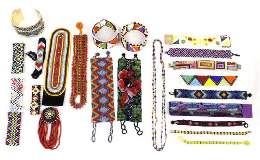 Collection of African Beaded Jewelry: Collection of African Beaded Jewelry, features 1 necklace and 22 bracelets, longest is the necklace measuring 44''L end to end, fabulous colors and designs