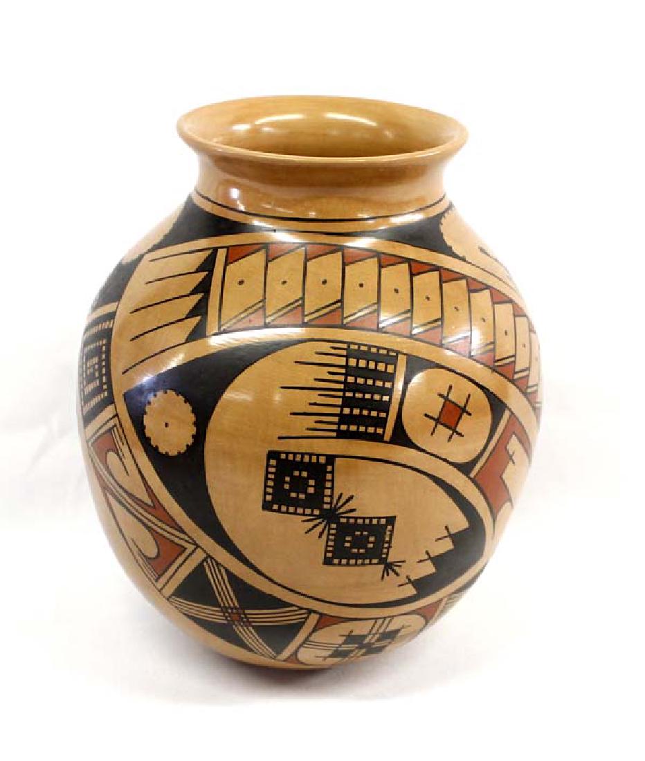 Mata Ortiz Polychrome Jar by Chela Ortiz: Mexican Mata Ortiz Polychrome Jar by Chela Ortiz, measures 8'' x 9'' and is signed by the artist, features Paquime' inspired lines and designs