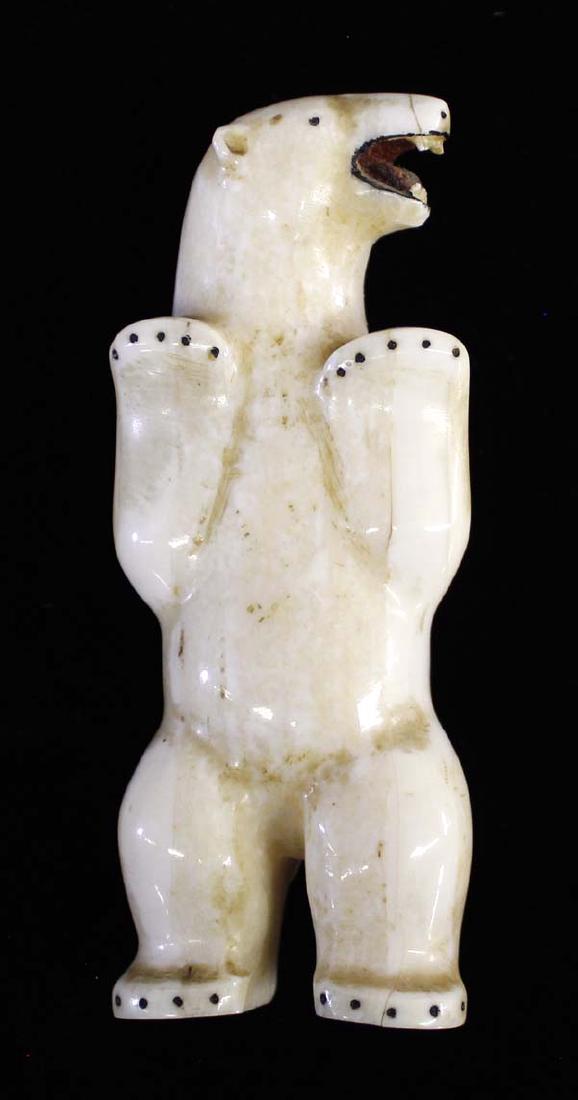 Native American Eskimo Carved Polar Bear-Kokuluk: Native American Eskimo Carved Bone Polar Bear by John Kokuluk of King Island, Alaska, intricate details, bear is barring teeth and standing tall, signed by artist and measures 4''H x 2''W, fabulous ca