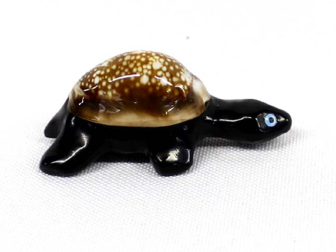 Native American Zuni Onyx Turtle Fetish: Hummert Estate: Native American Zuni Onyx Turtle Fetish, measures 1.5''L, turquoise eyes, has a cowry shell carapace