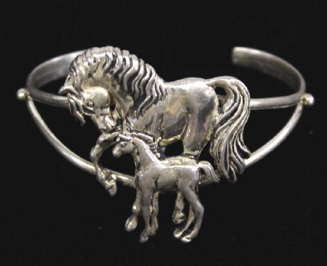 Southwestern Sterling Silver Horse Bracelet: Southwestern Sterling Silver Horse Bracelet, all sterling silver, has been tested, depicts a mare and her foal, inside measures 6'' which includes opening x 1.5''W, stamped sterling and copyrighted ha
