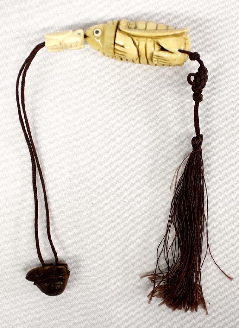 Japanese Carved Bone Netsuke on Silk Cord: Hummert Estate: Japanese Carved Bone Netsuke on Silk Cord, the larger turtle is a lidded box, the smaller carved bone turtle keeps the box closed when pulled tight up against the head of the larger tu