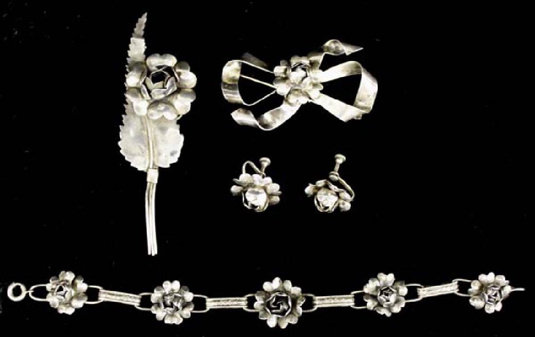 Collection of Antique Silver Jewelry: Collection of Antique 1920's Silver Jewelry, includes 2 pins, bracelet, and pair of screwback earrings, all pieces are stamped sterling, longest measures 7.5''L