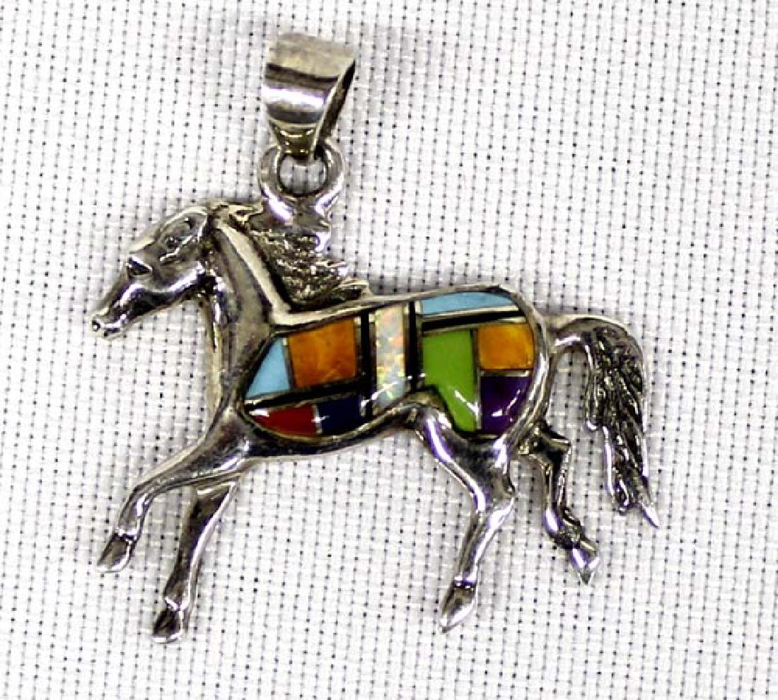 Native American Navajo Sterling Inlay Pendant: Native American Navajo Sterling Inlay Horse Pendant, measures 1.5'' x 1'', hallmarked WR and stamped sterling, inlay includes gaspeite, opal, red shell, jet, and sugilite